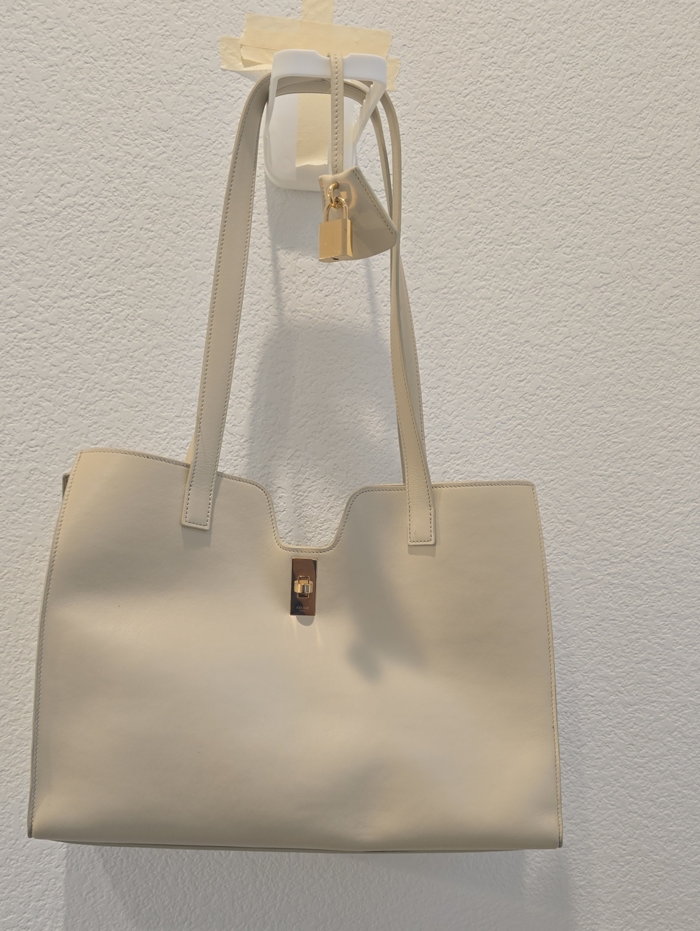Elegant Cream Leather Tote Bag with Gold Accent